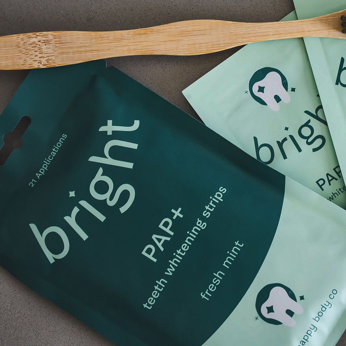 Bright PAP+ whitening strips pouch and sachets with a bamboo toothbrush