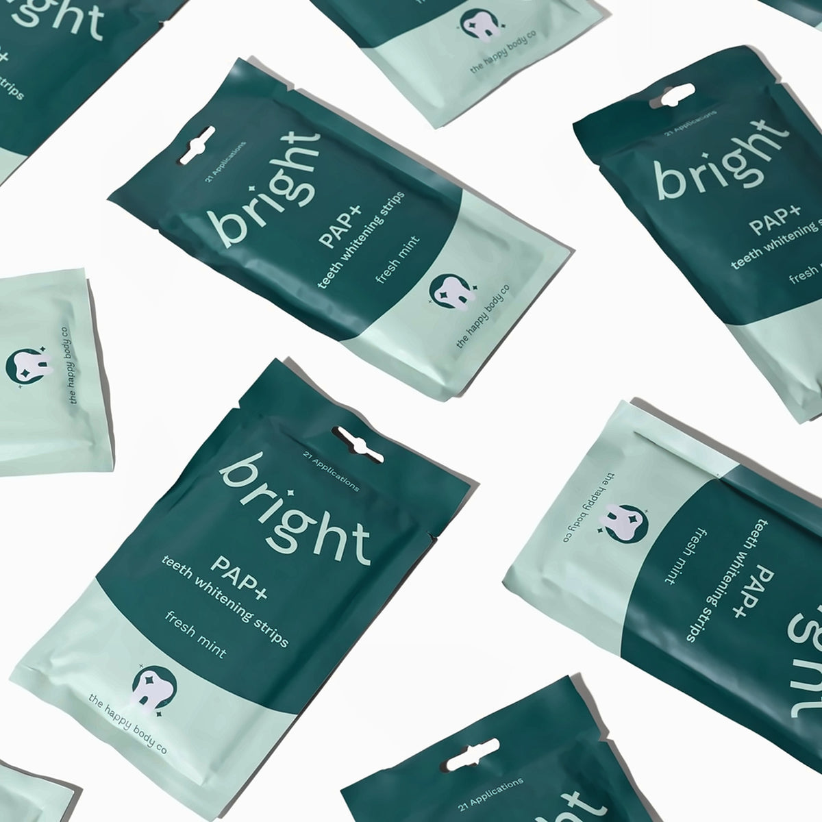 Pouches of Bright PAP+ teeth whitening strips by The Happy Body Co